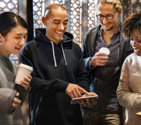 group of young people drinking coffee