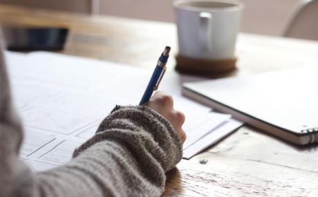 woman taking notes