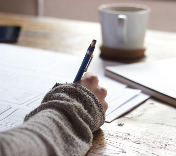 woman taking notes