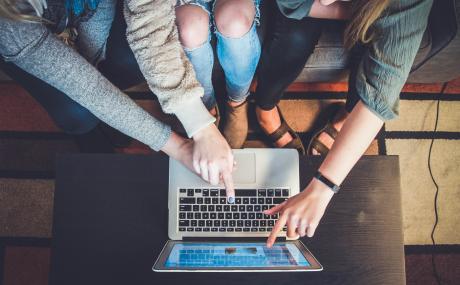 people collaborating with laptop