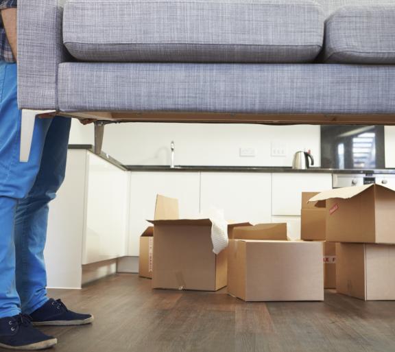 man moving a couch