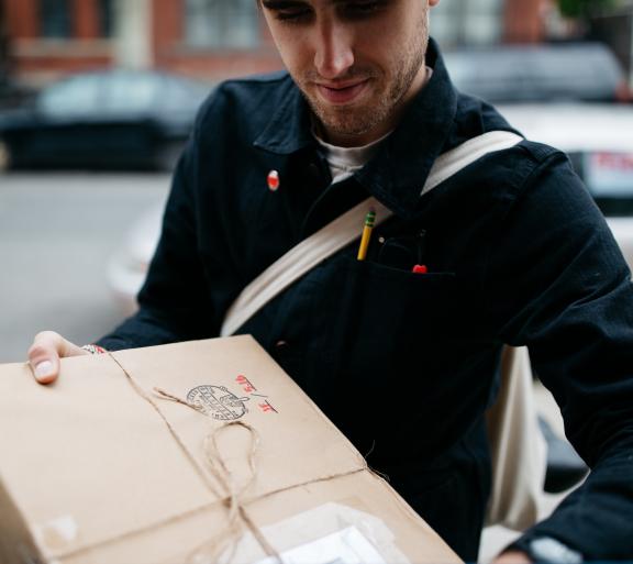 person holding package