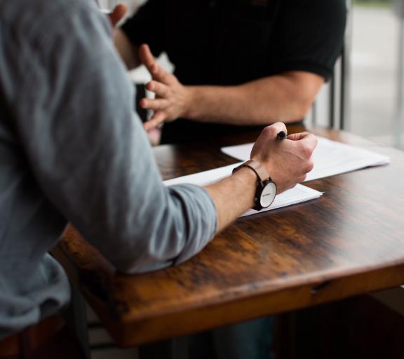 person writing on desk